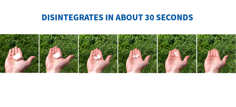 Biodegradable packaging peanuts dissolving in water on a hand.
